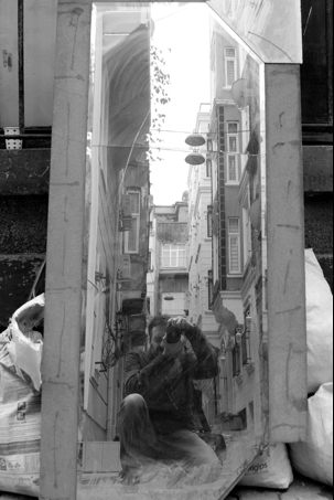 Self-portrait with a broken mirror in the streets of Tarlabaşı, one of the poorest neighborhoods in Istanbul, 2015 